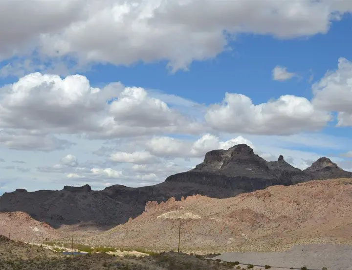 A mountain range with clouds in the sky.